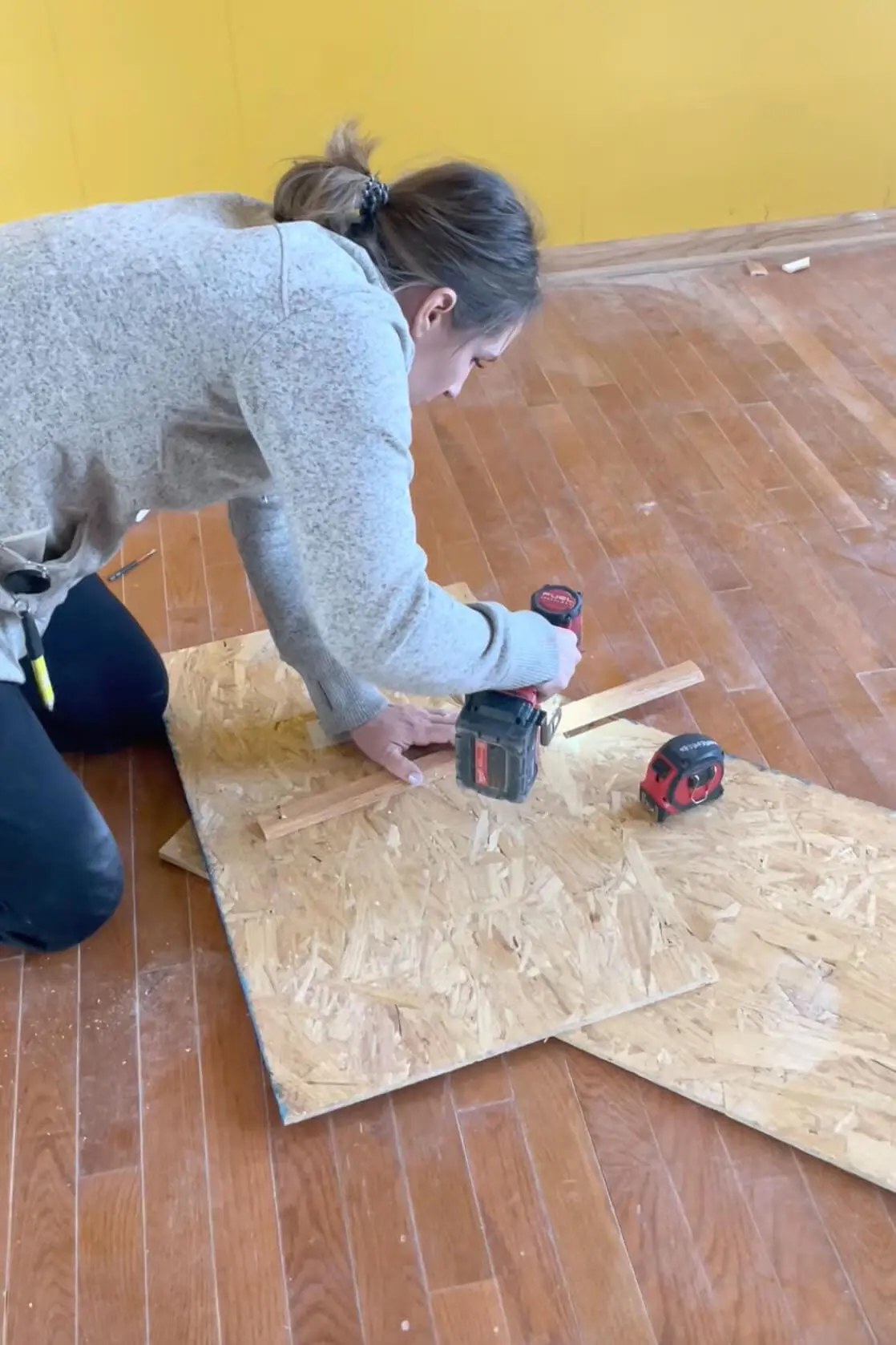 Measuring on a board to make an arched doorway. 
